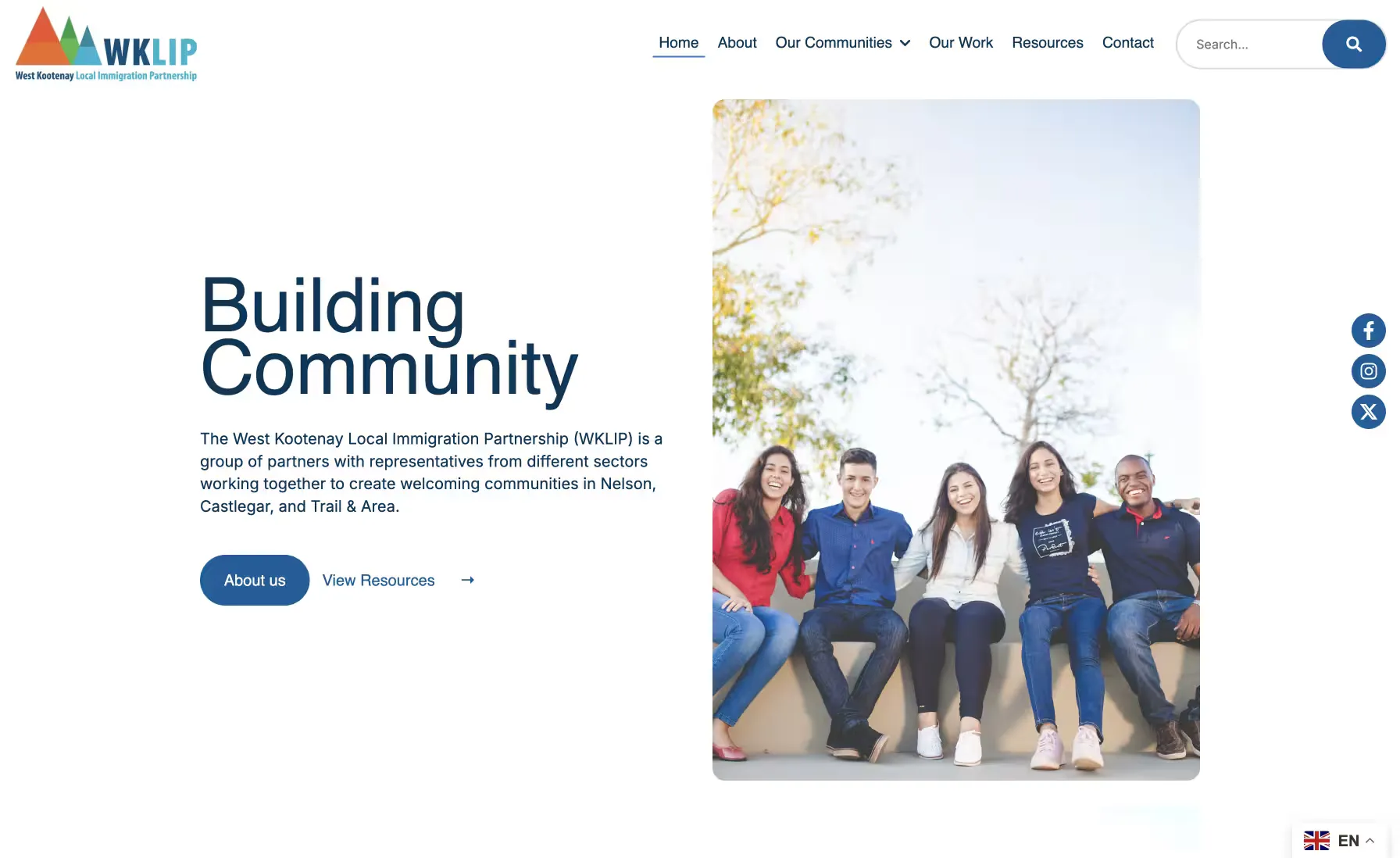 The West Kootenay Local Immigration Partnership site: a “Building Community” homepage introducing the partnership beside a photograph of five people.